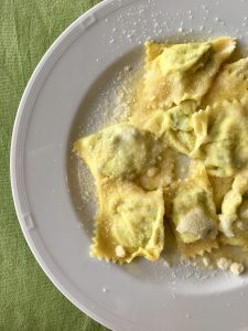 tortelli on a plate described by tour guide on the food tour parma
