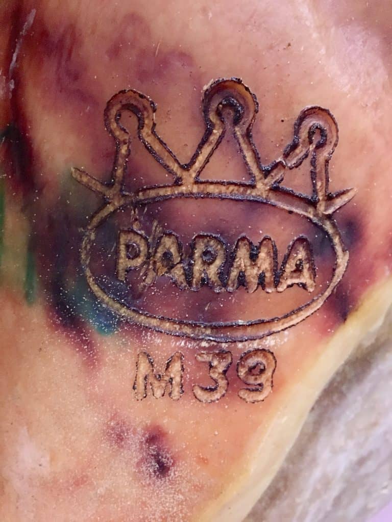 Parma logo on a prosciutto