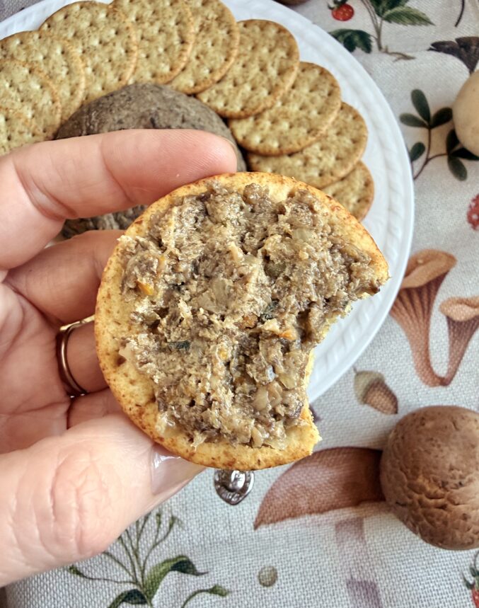 pate on cracker with bite taken