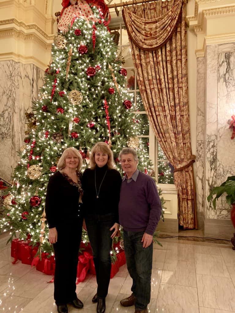 My parents and me with Christmas decor at the Hermitage Hotel, Nashville