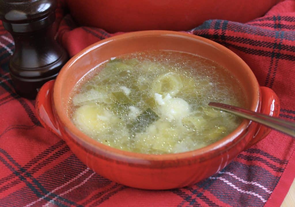 Cock a leekie soup in a bowl