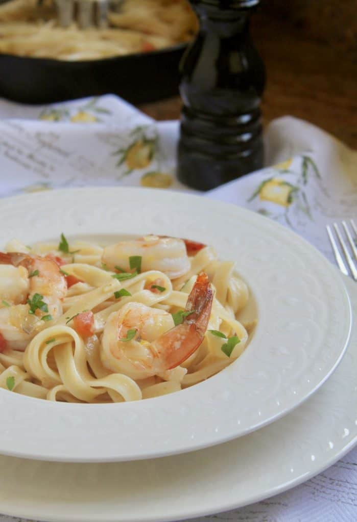 Shrimp fettuccine with cream and tomatoes ready to eat