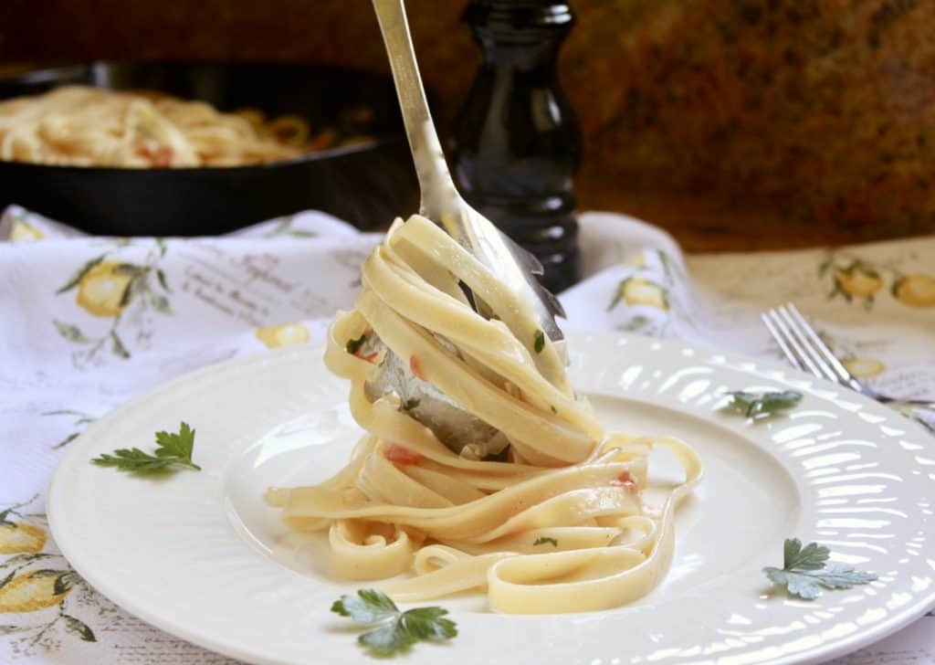 twirling the fettuccine to serve