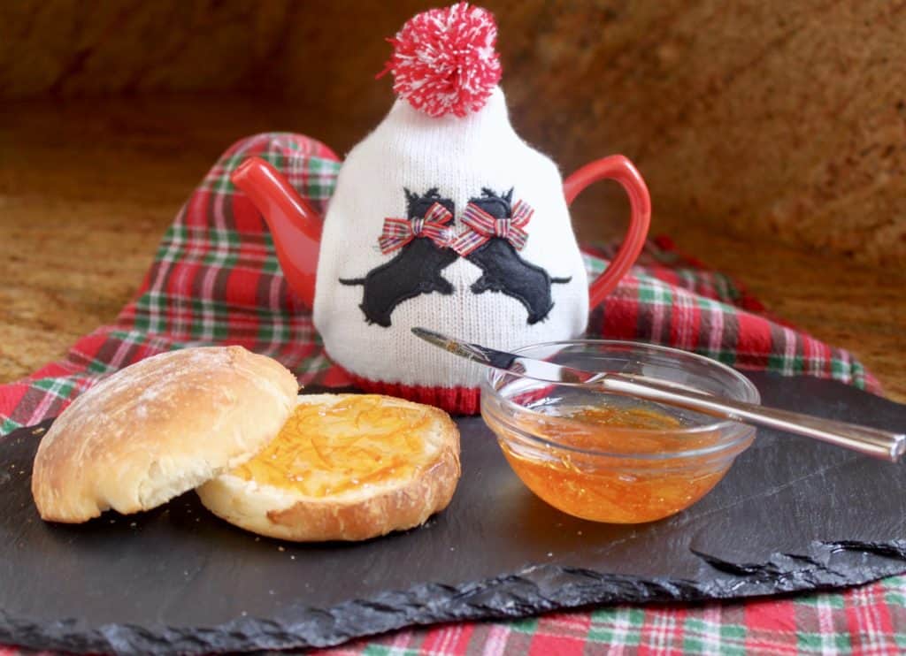 Drambuie Marmalade with scottie dog tea cosy on a teapot and bread roll