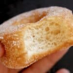 close up of a bitten vegan handheld doughnut