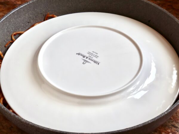 plate over pasta to flip
