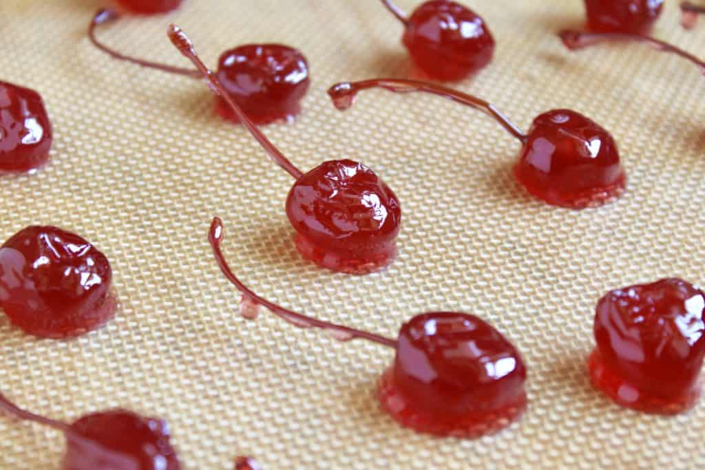 homemade candied cherries (glacé cherries) on a mat