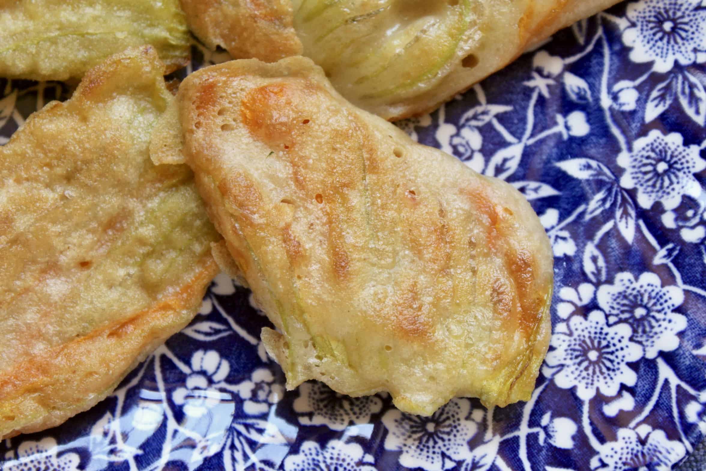 close up of a fried zucchini blossom
