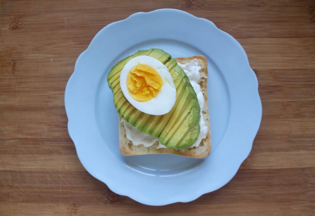 avocado toast with burrata and egg