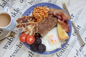 full Scottish breakfast with lorne sausage, black pudding, egg, toast, bacon, tomato, potato scones and Heinz beans