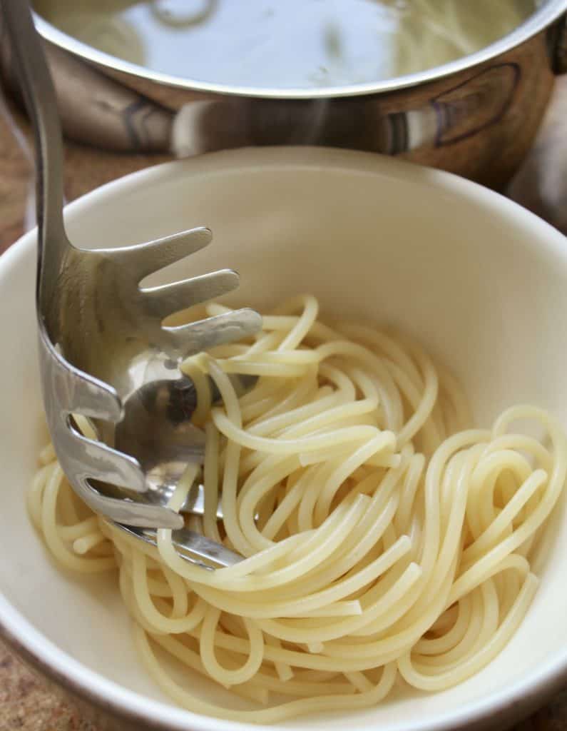 draining spaghetti 