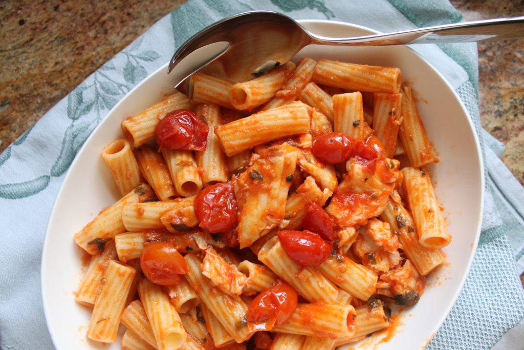 fish in tomato sauce with pasta for healthy meals on a budget