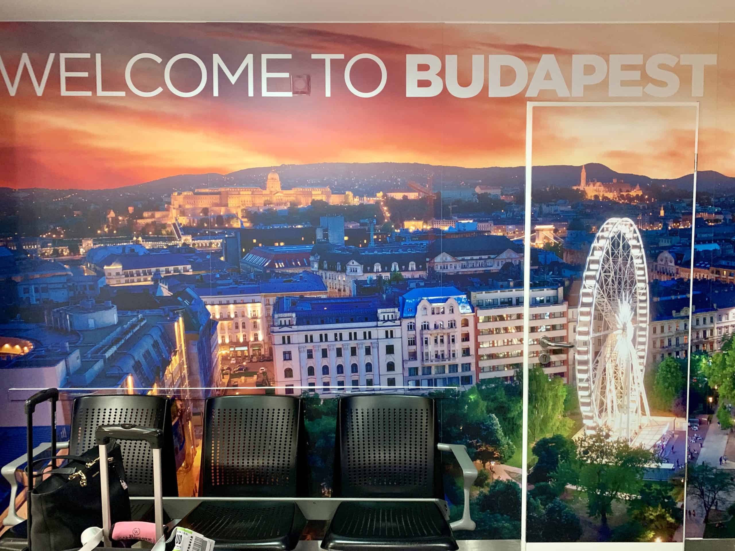 welcome to budapest sign at airport