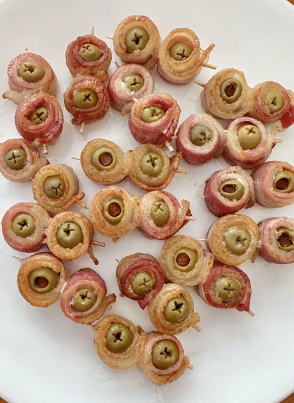 bacon wrapped olives on toothpicks