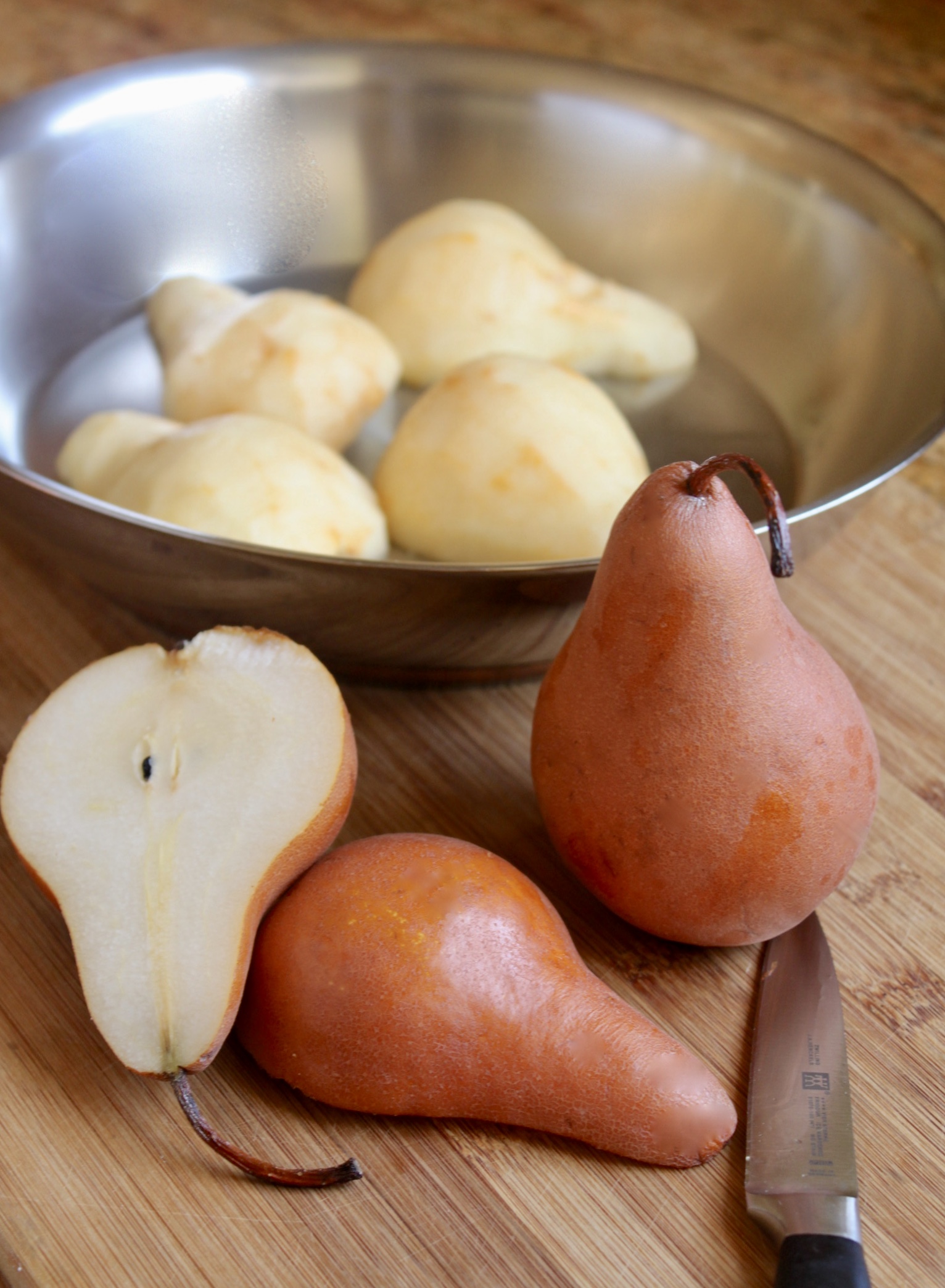 peeled pears in pan