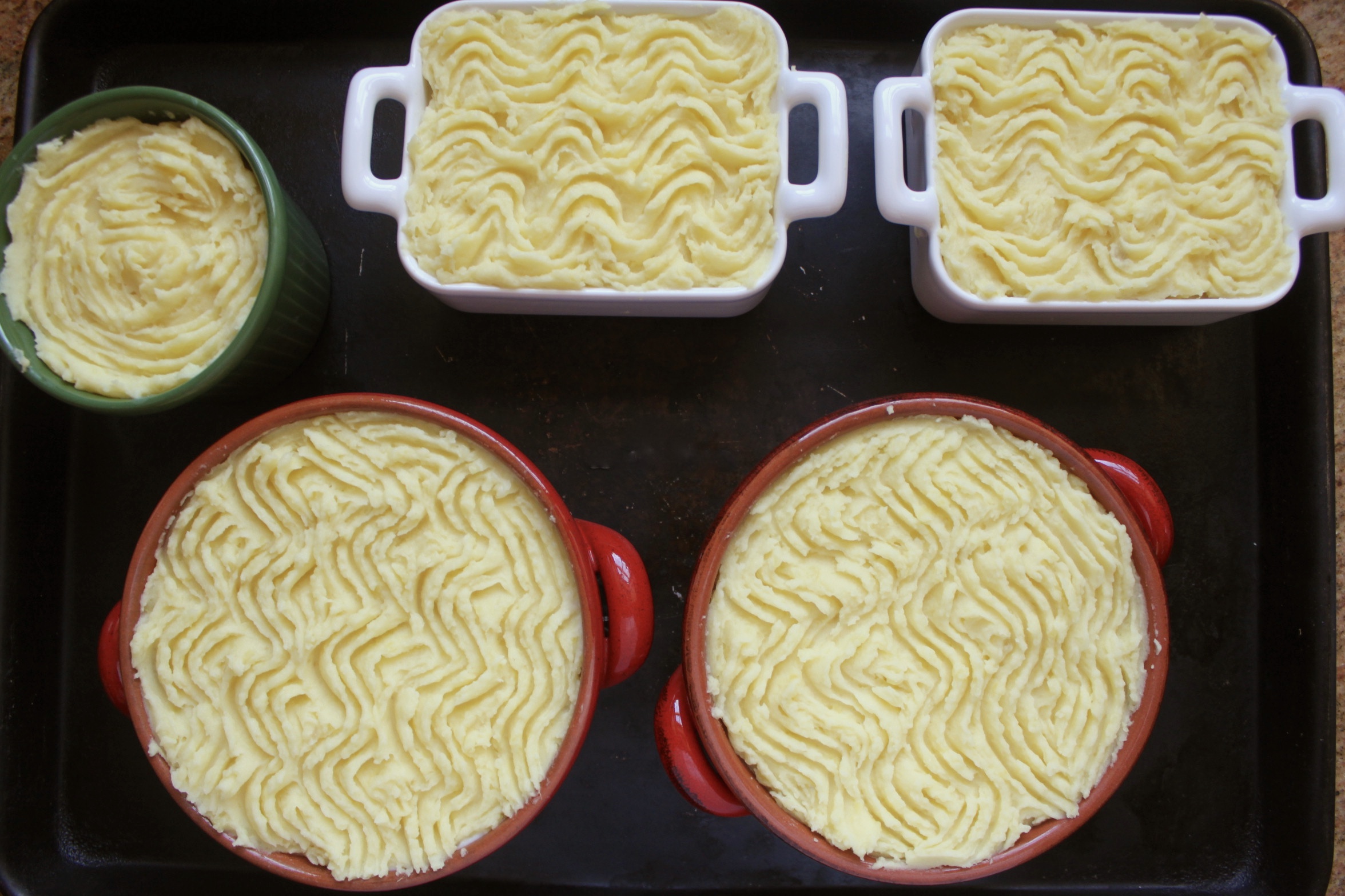 unbaked fish pies on a tray
