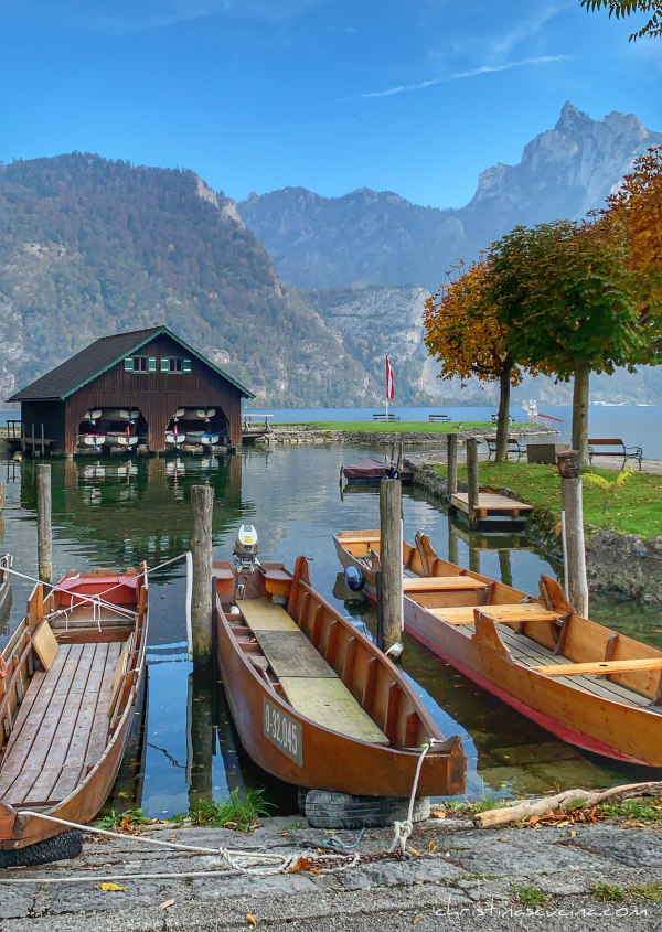 boats in the water in the Austrian Lake District by Christina Conte