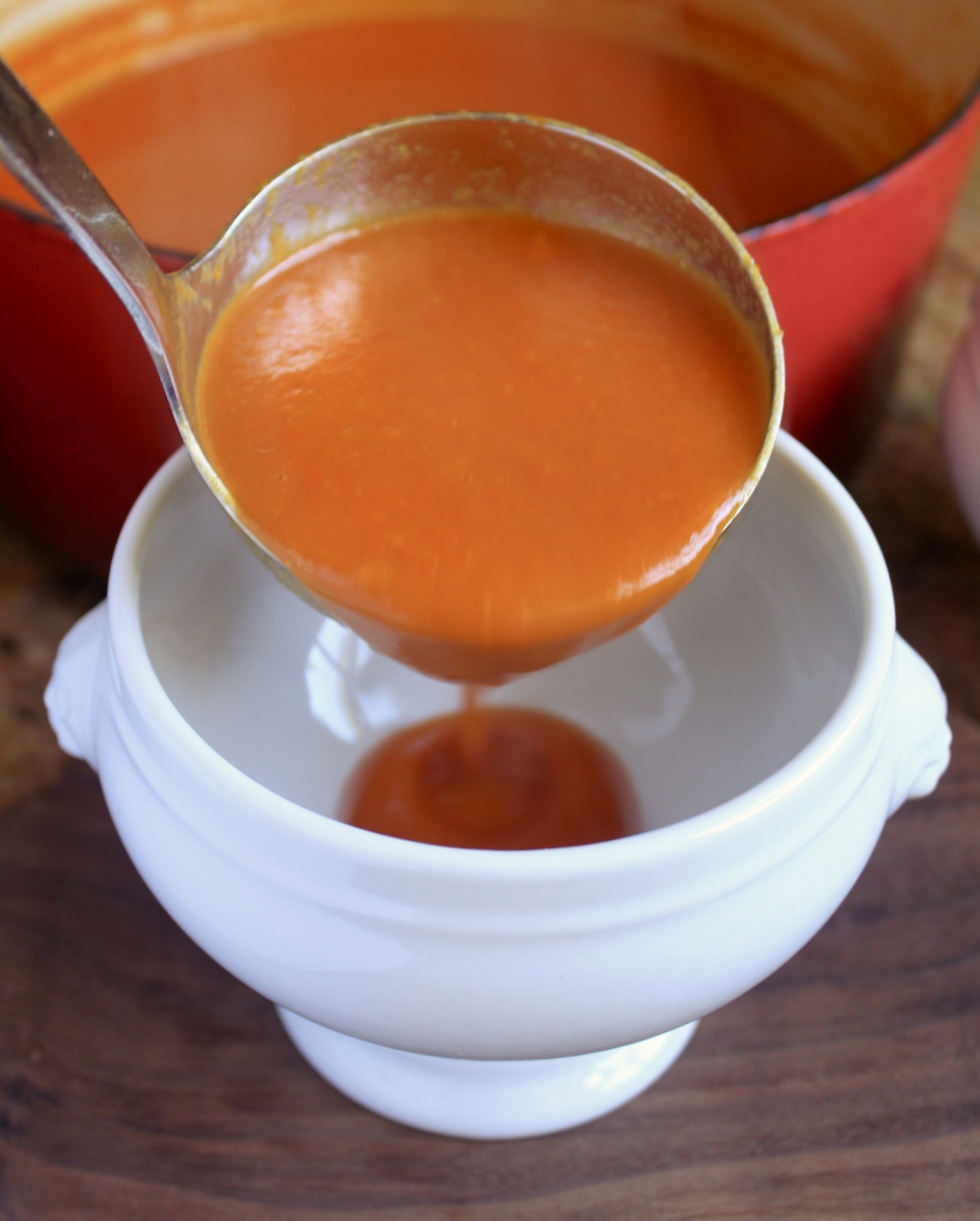 pouring soup into bowl