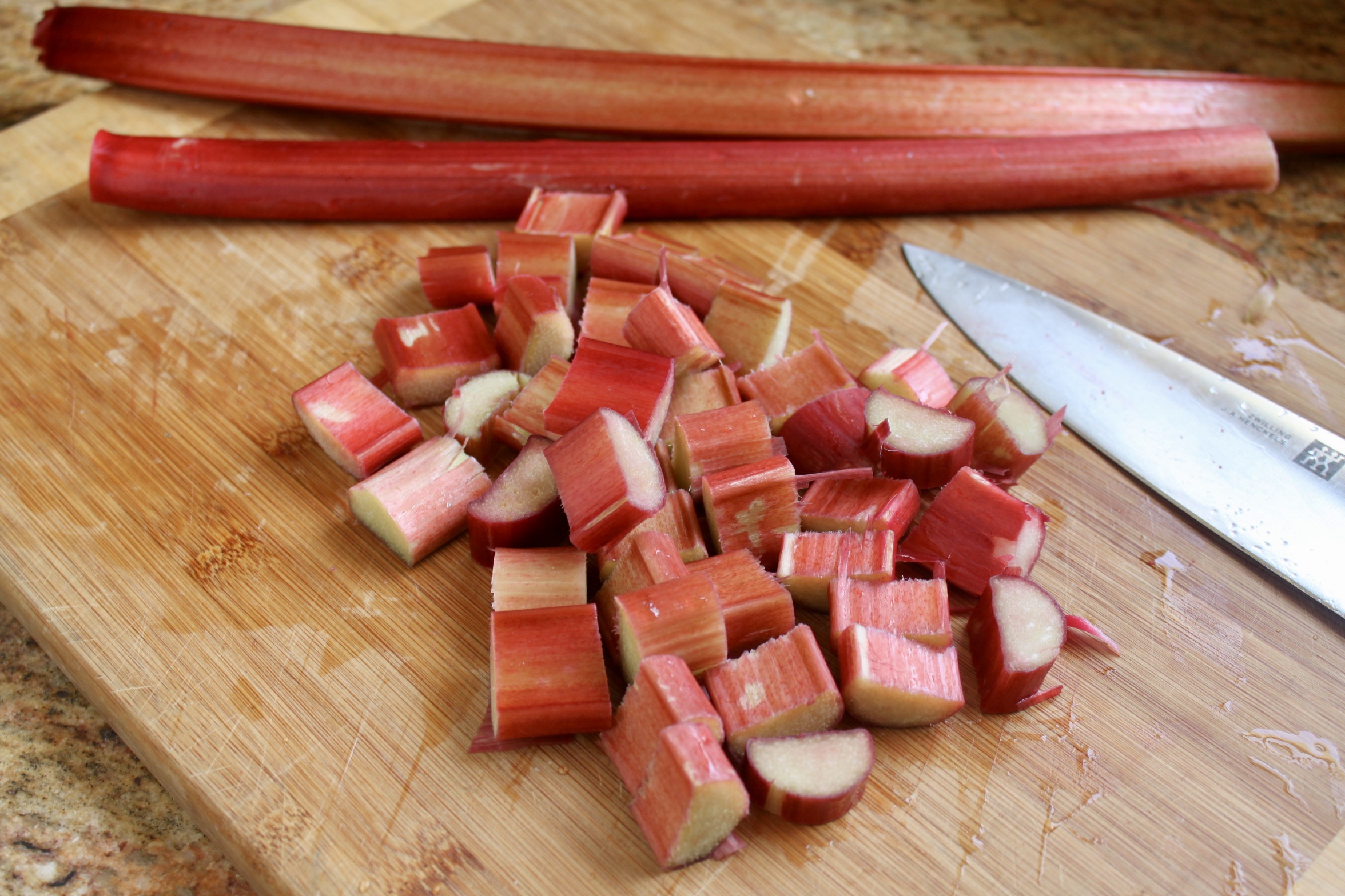 chopped rhubarb stalks on a cutting board
