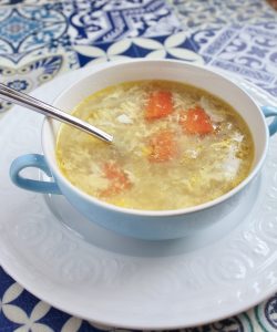 pastina soup in a blue bowl