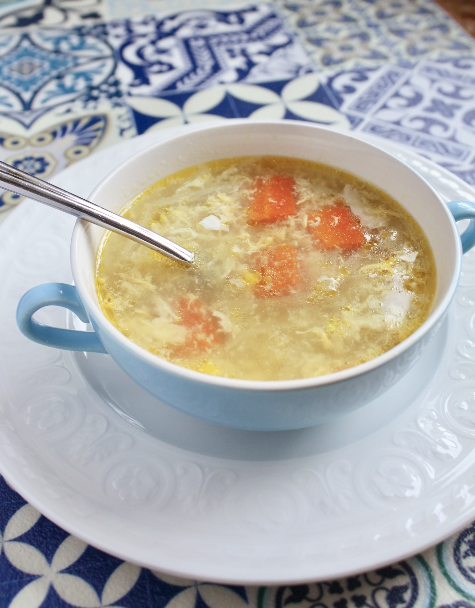 pastina soup in a blue bowl