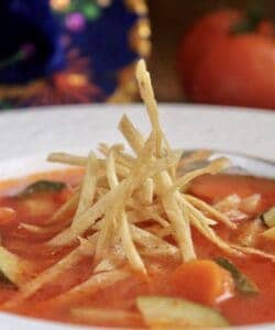 tortilla soup with crunchy tortilla strips in bowl