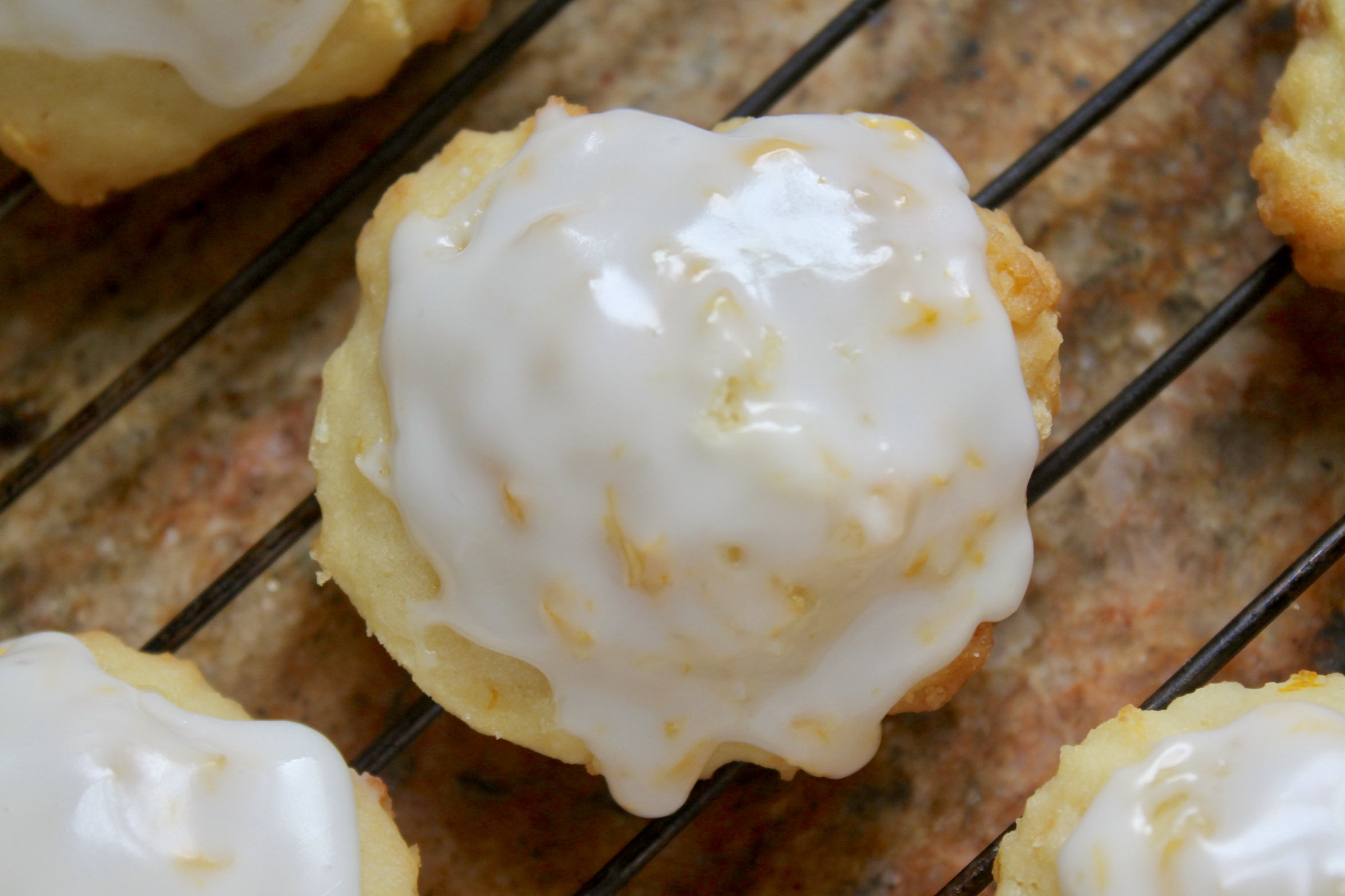 lemon ricotta cookie on a cooling rack