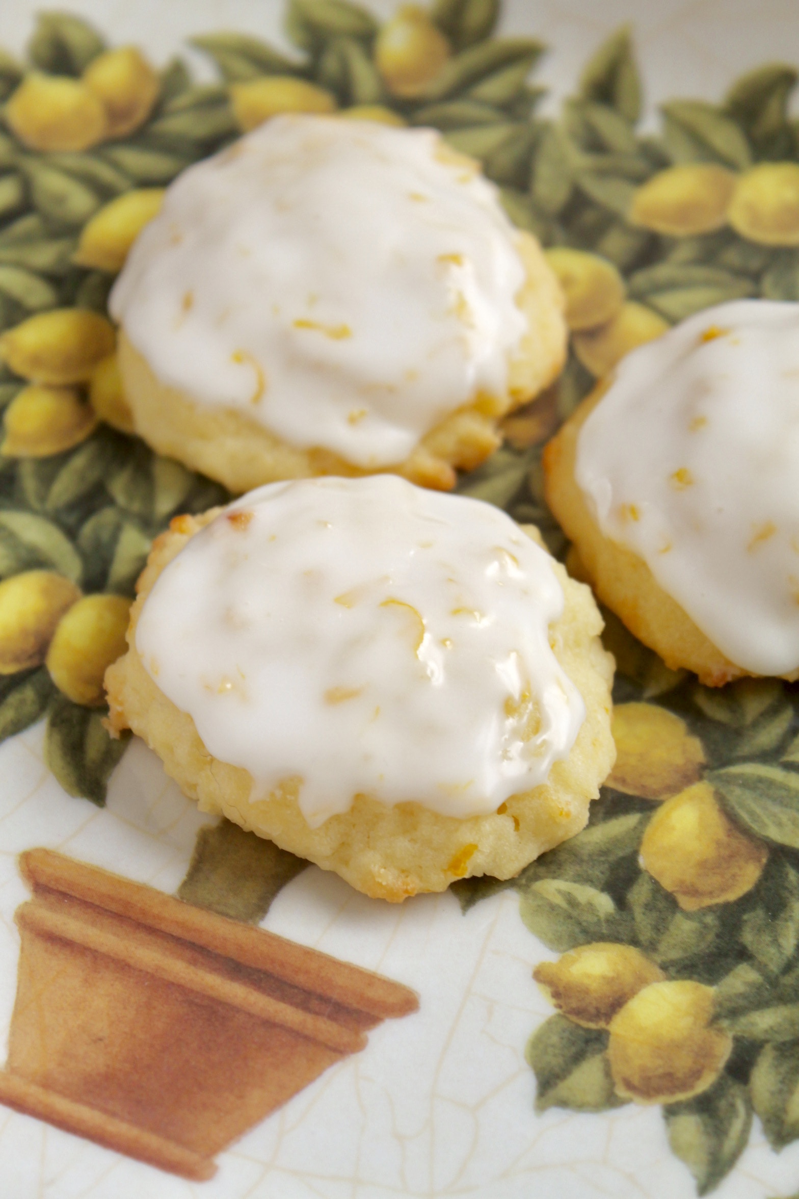 lemon ricotta cookies on a lemon plate