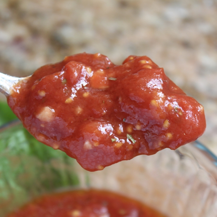 pizza sauce in a spoon