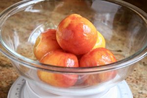 bowl of peeled peaches