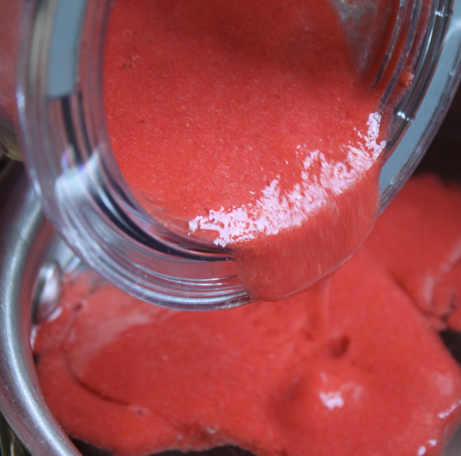 pouring strawberry puree into pot