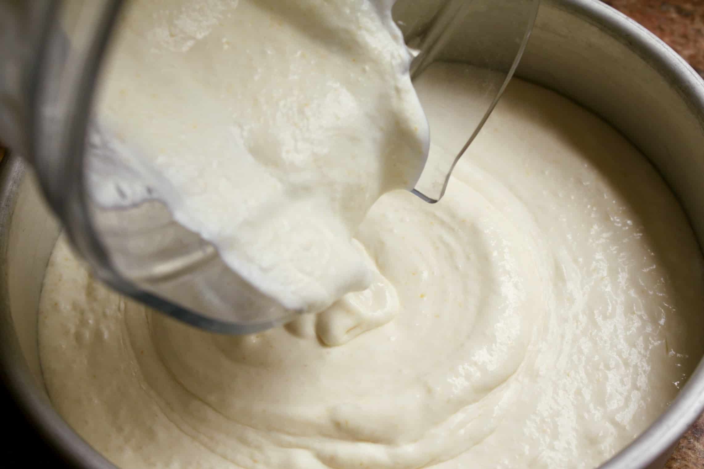 pouring cream mixture into pan