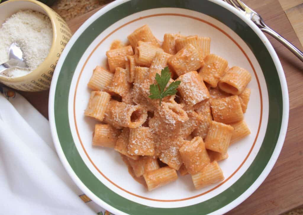 creamy zucchini and tomato sauce on mezzi rigatoni for what to eat with pasta