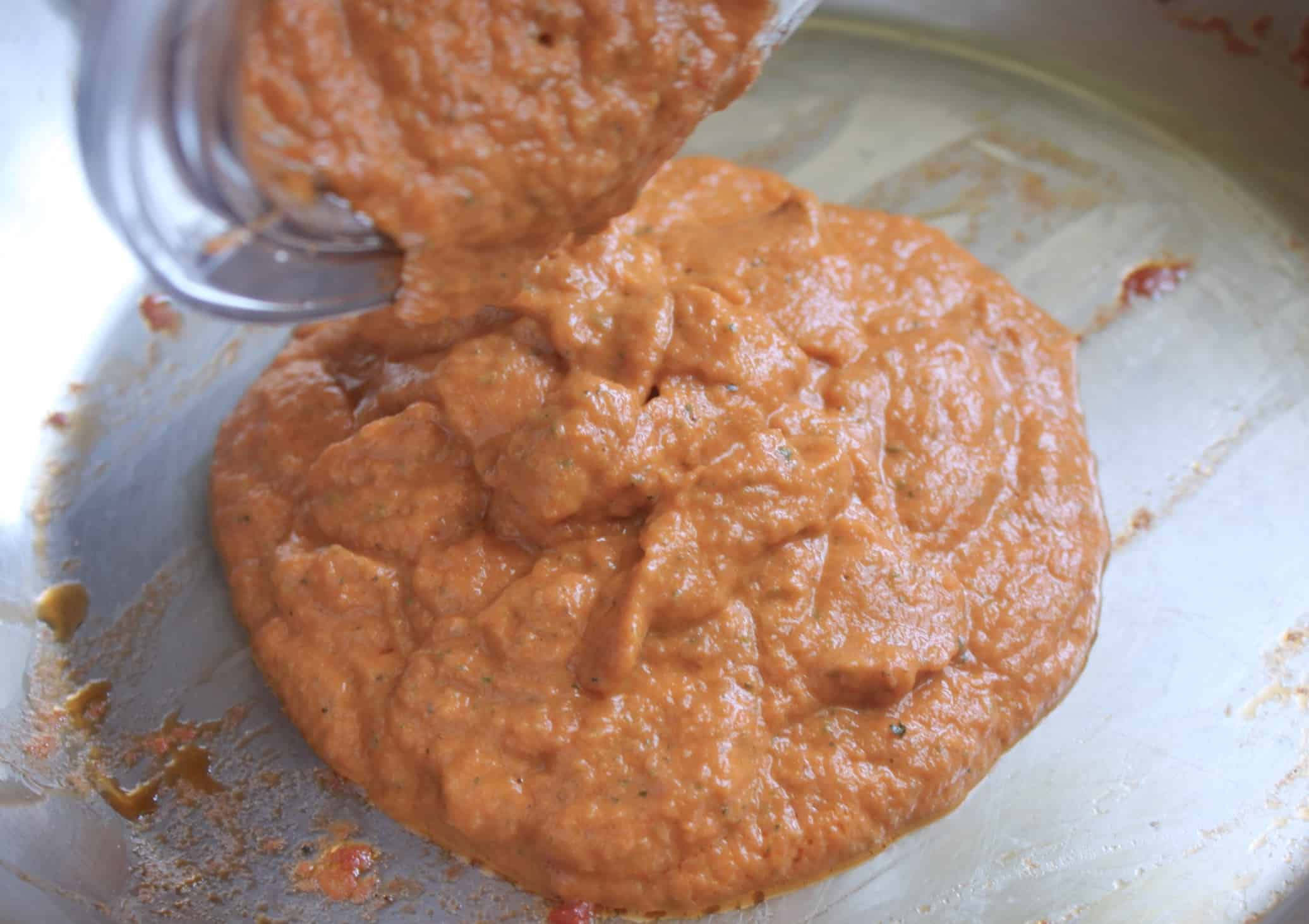 pouring sauce into pan