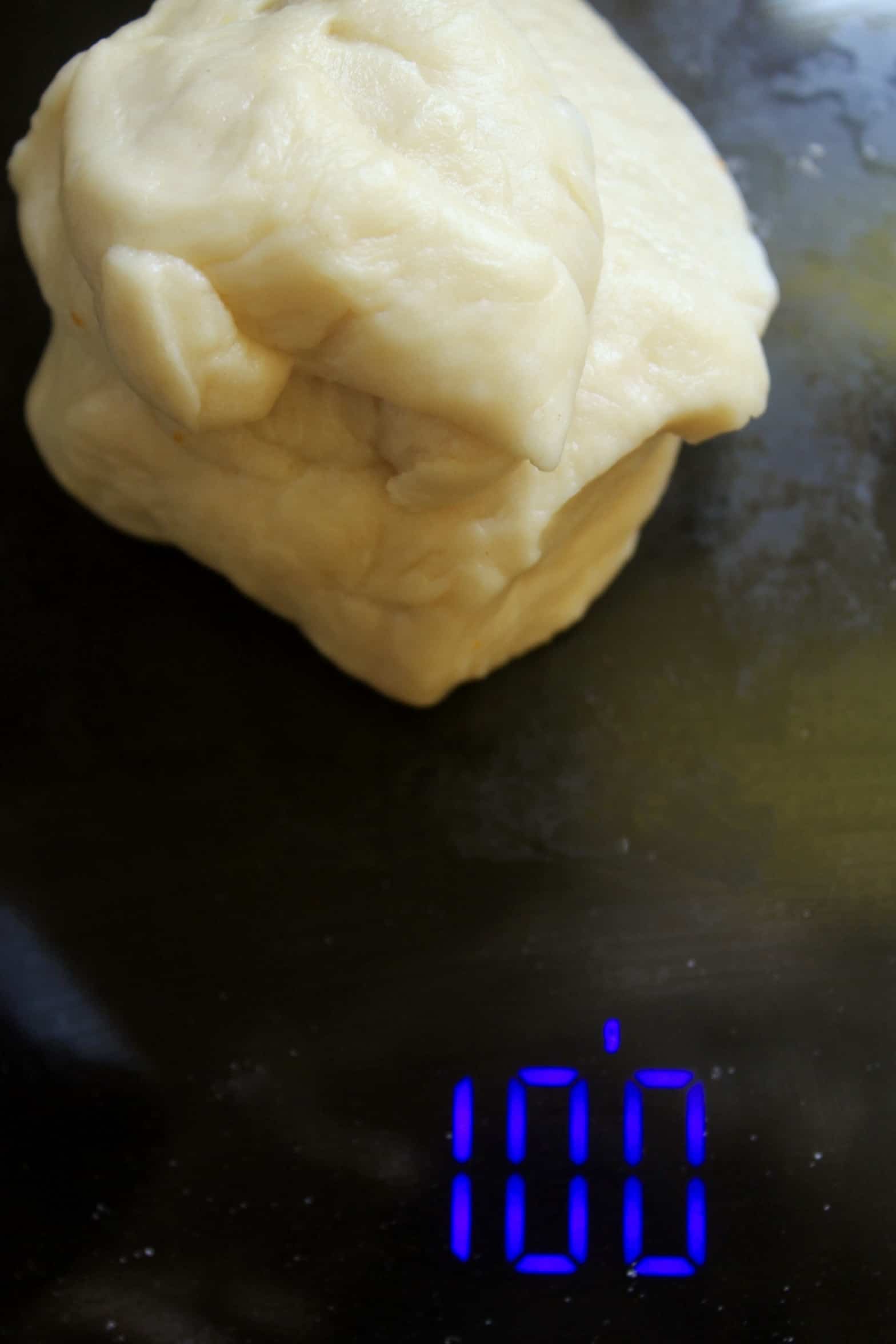 brioche dough on scale using my brioche bun recipe