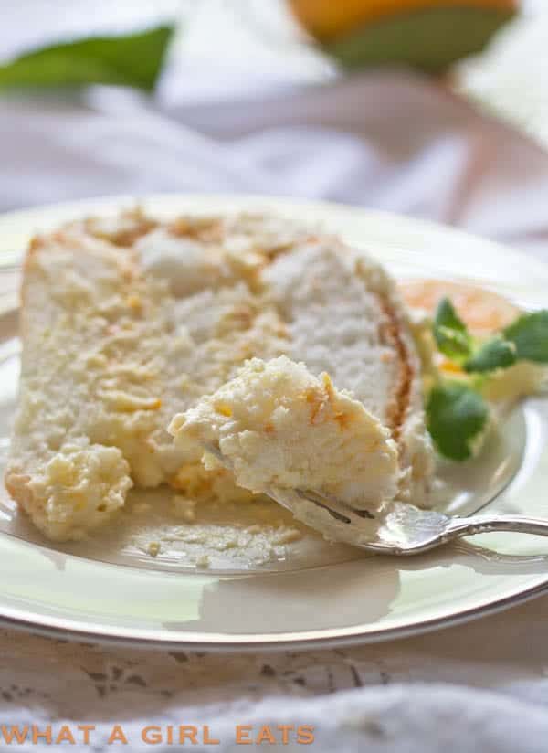 orange angel food cake on a plate by what a girl eats