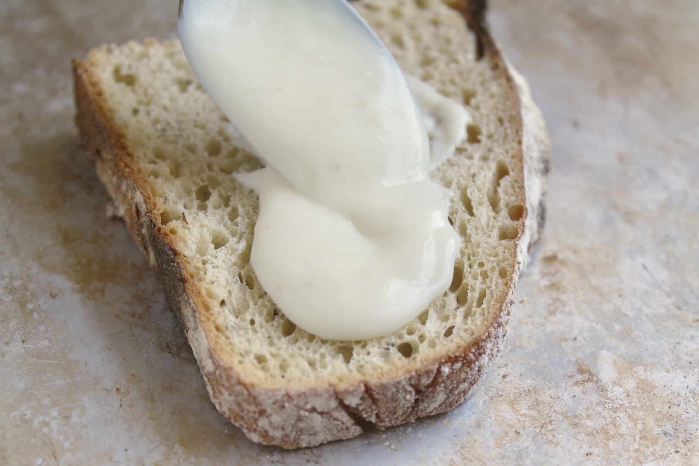 spreading bechamel on toast