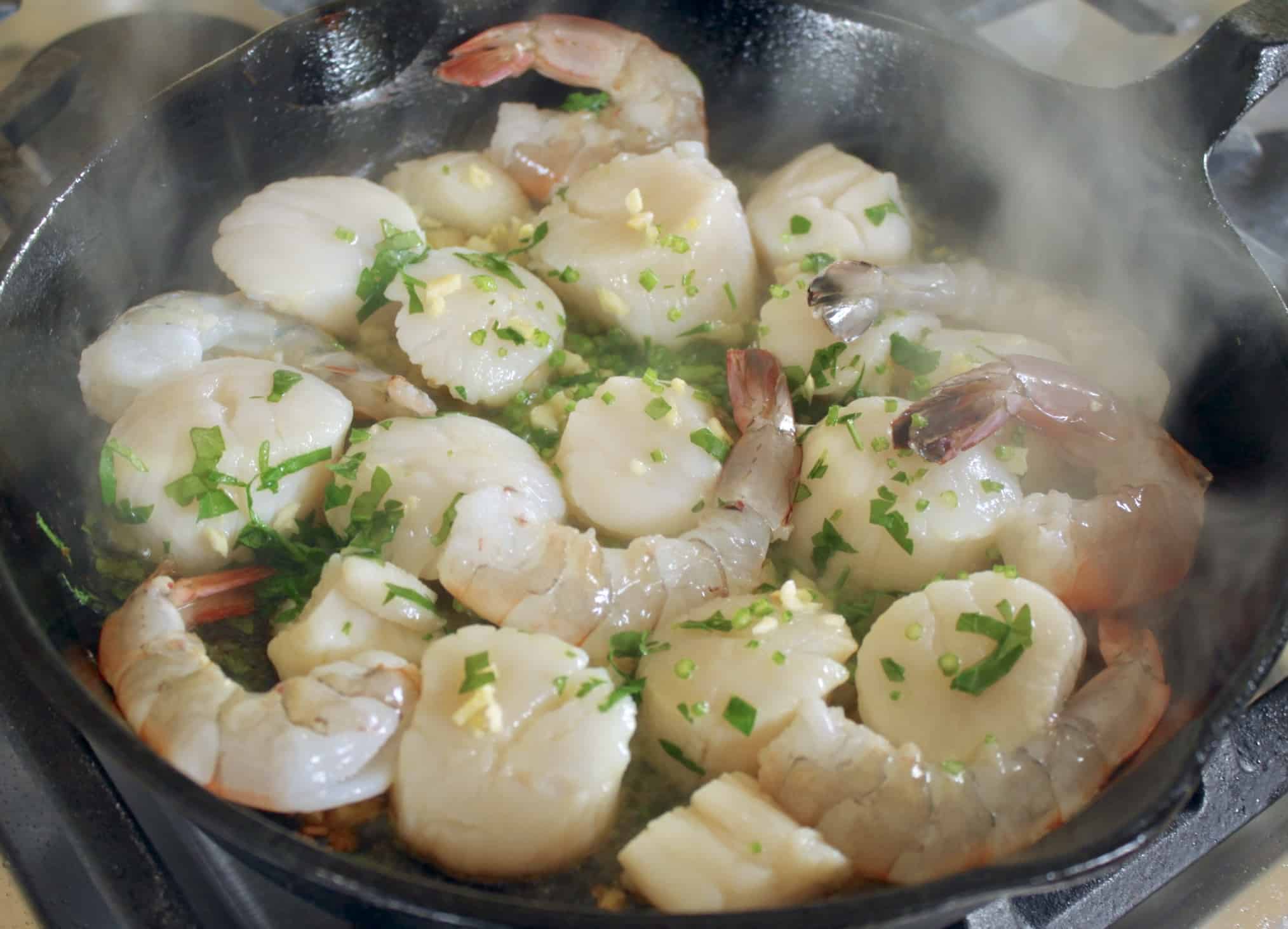 cooking shrimp and scallops in cast iron pan