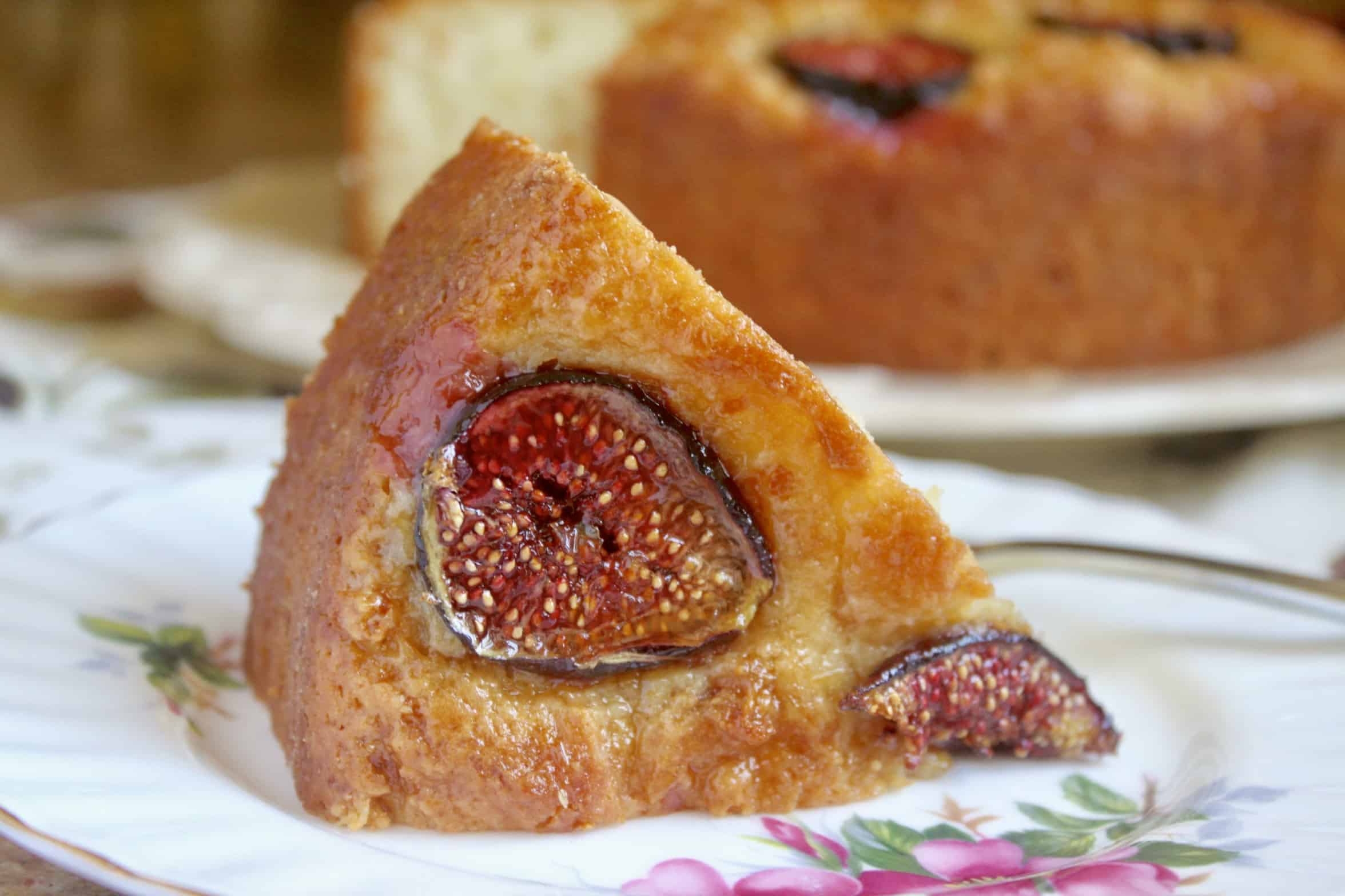 slice of fig cake with cake in background