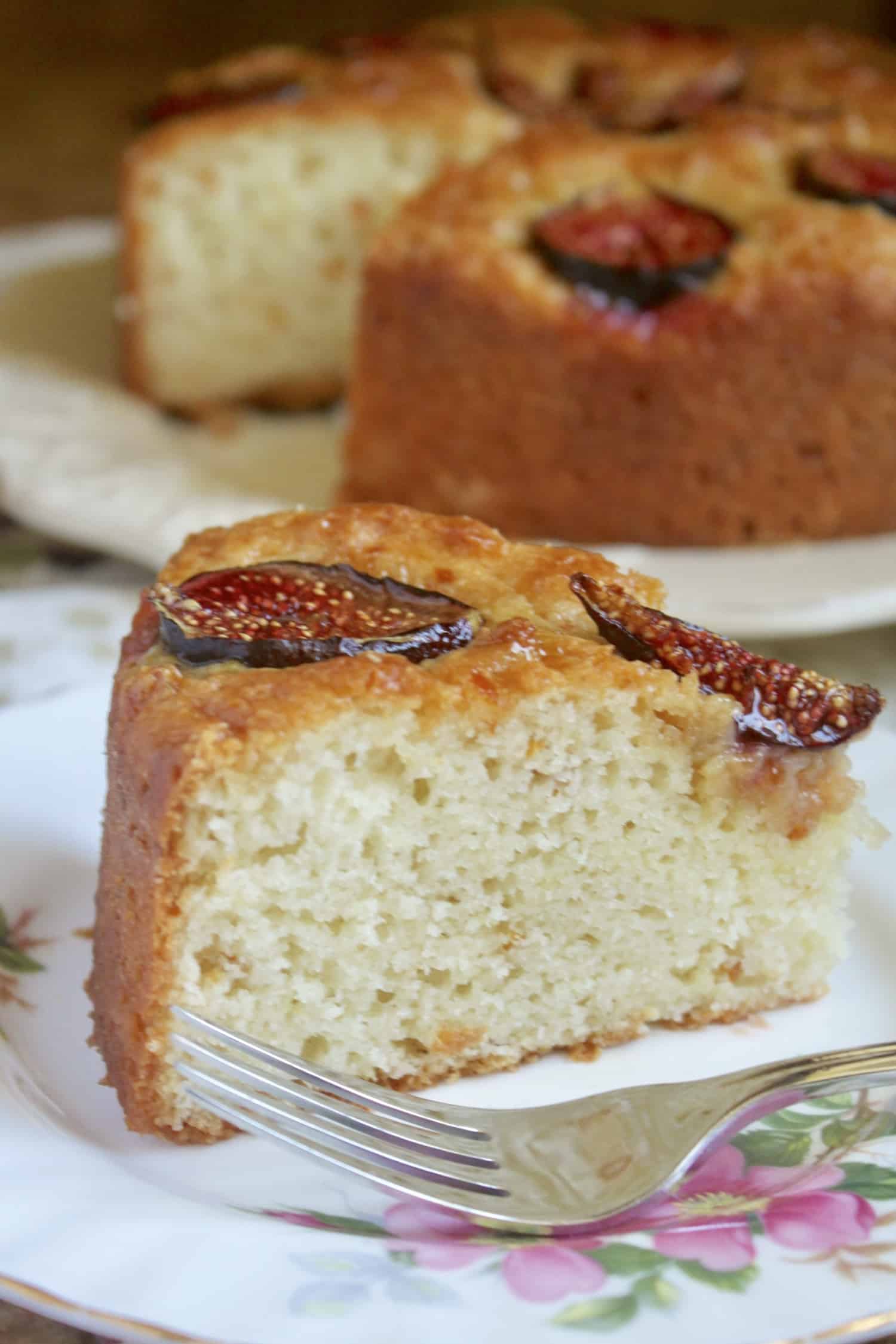 slice of fig cake with cake in background
