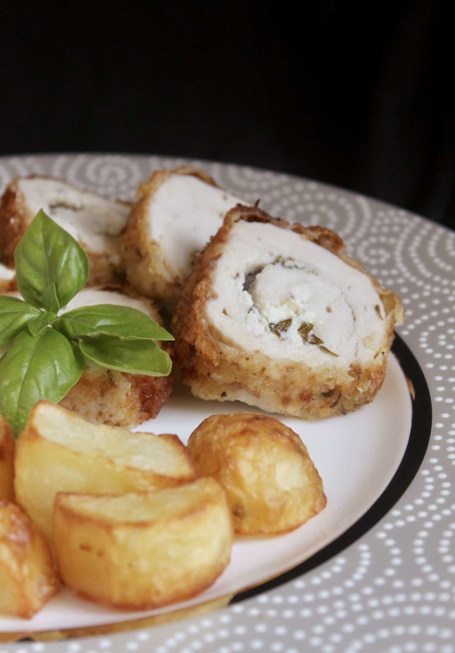 stuffed chicken breast fanned on a plate