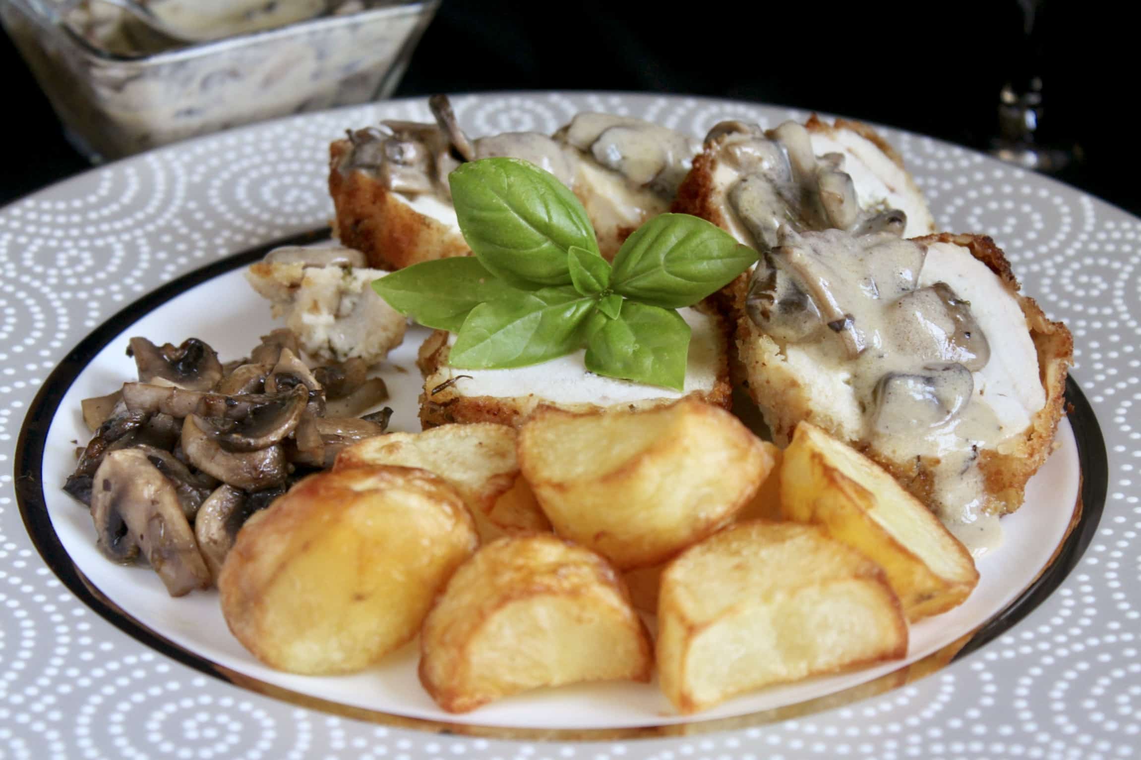 Stuffed Chicken Breast with Goat Cheese and basil and served with mushroom cream sauce and potatoes