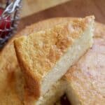 slice of cake on top of whole cake