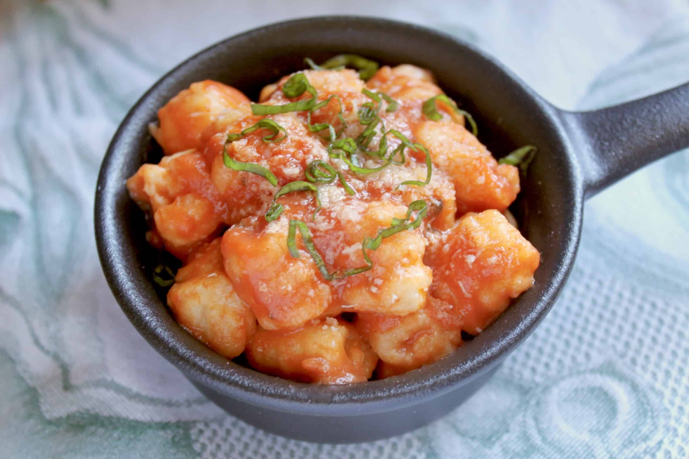potato gnocchi with tomato sauce in a ramekin