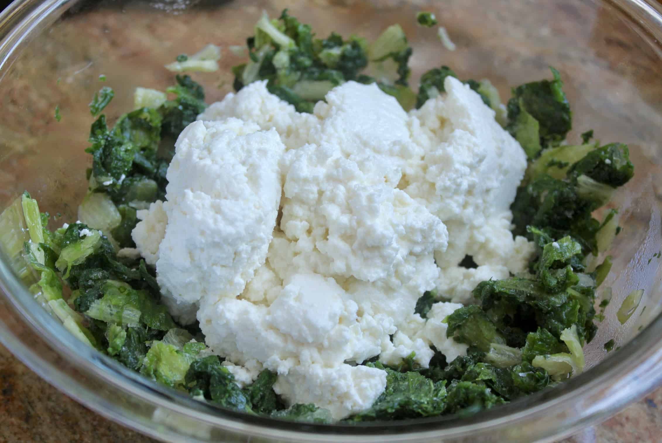 greens and ricotta in a bowl