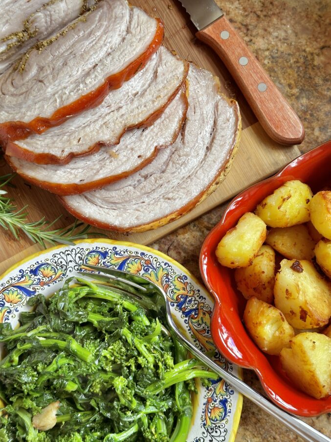 overhead porchetta, potatoes and rapini angled