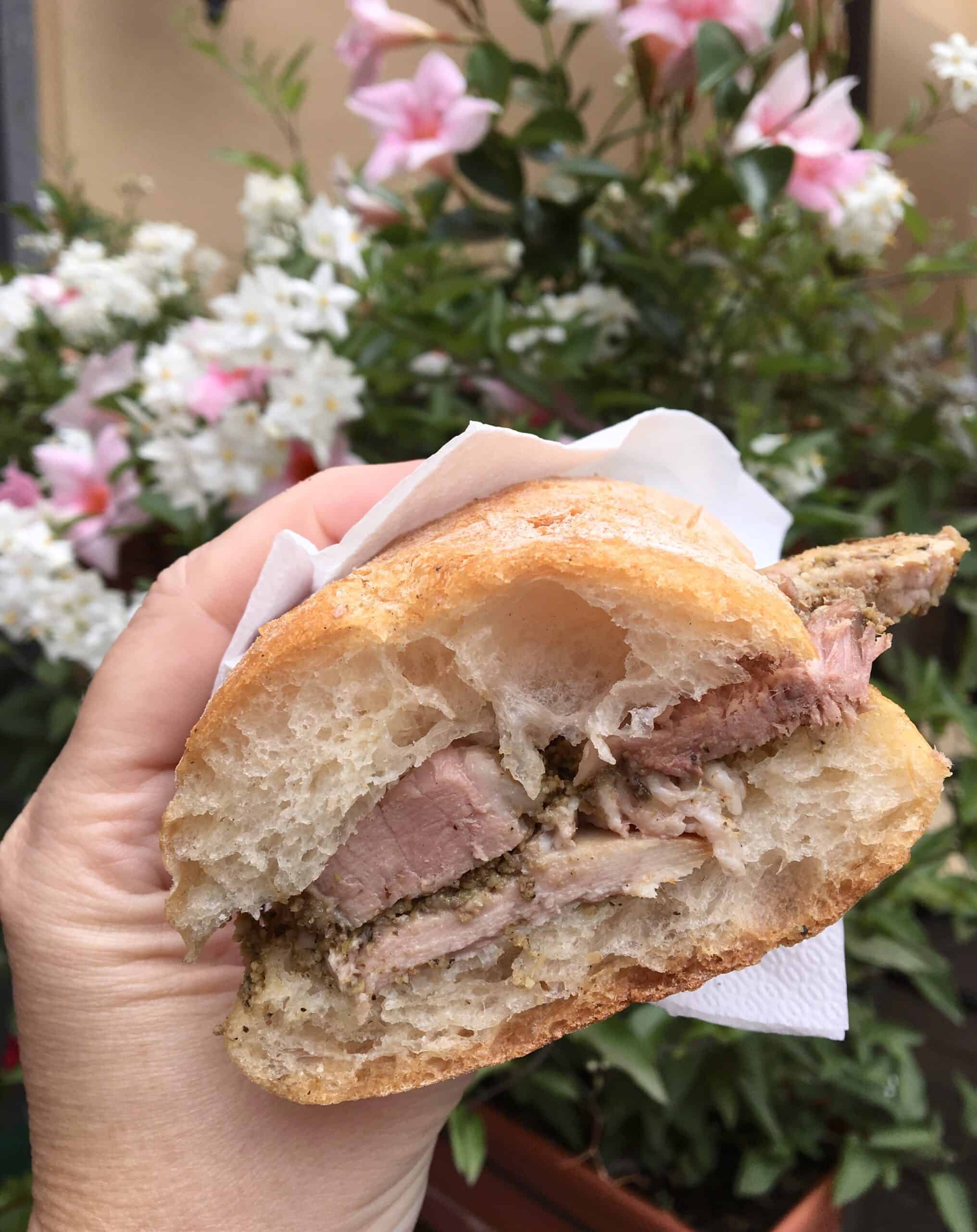 porchetta panino with flowers in the background