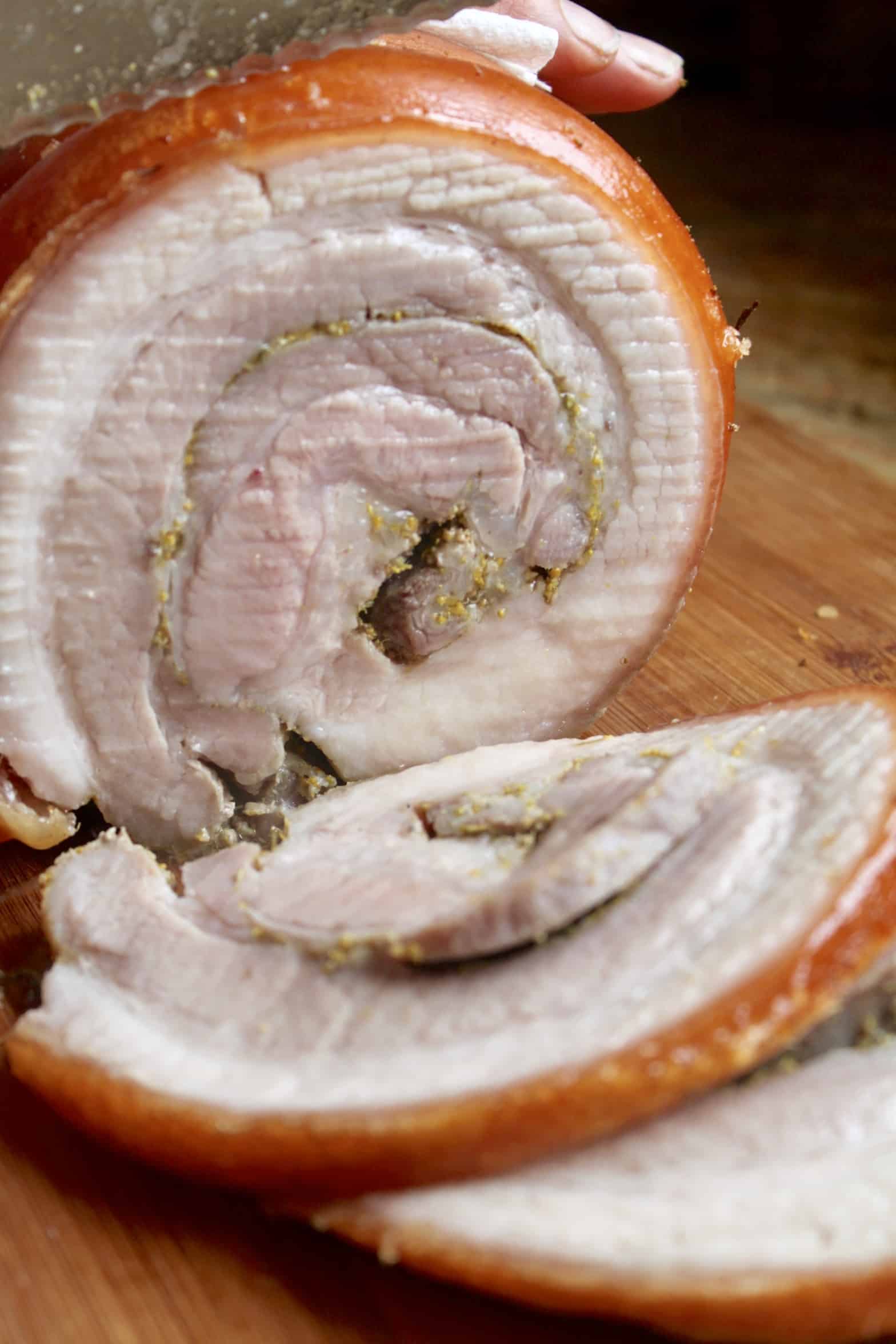 porchetta sliced on a board