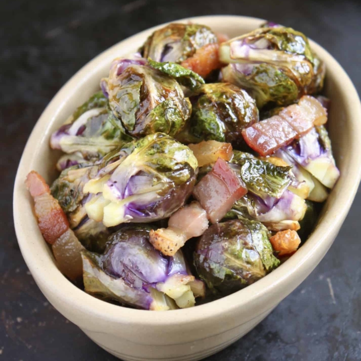 roasted brussel sprouts with pancetta in an oval dish