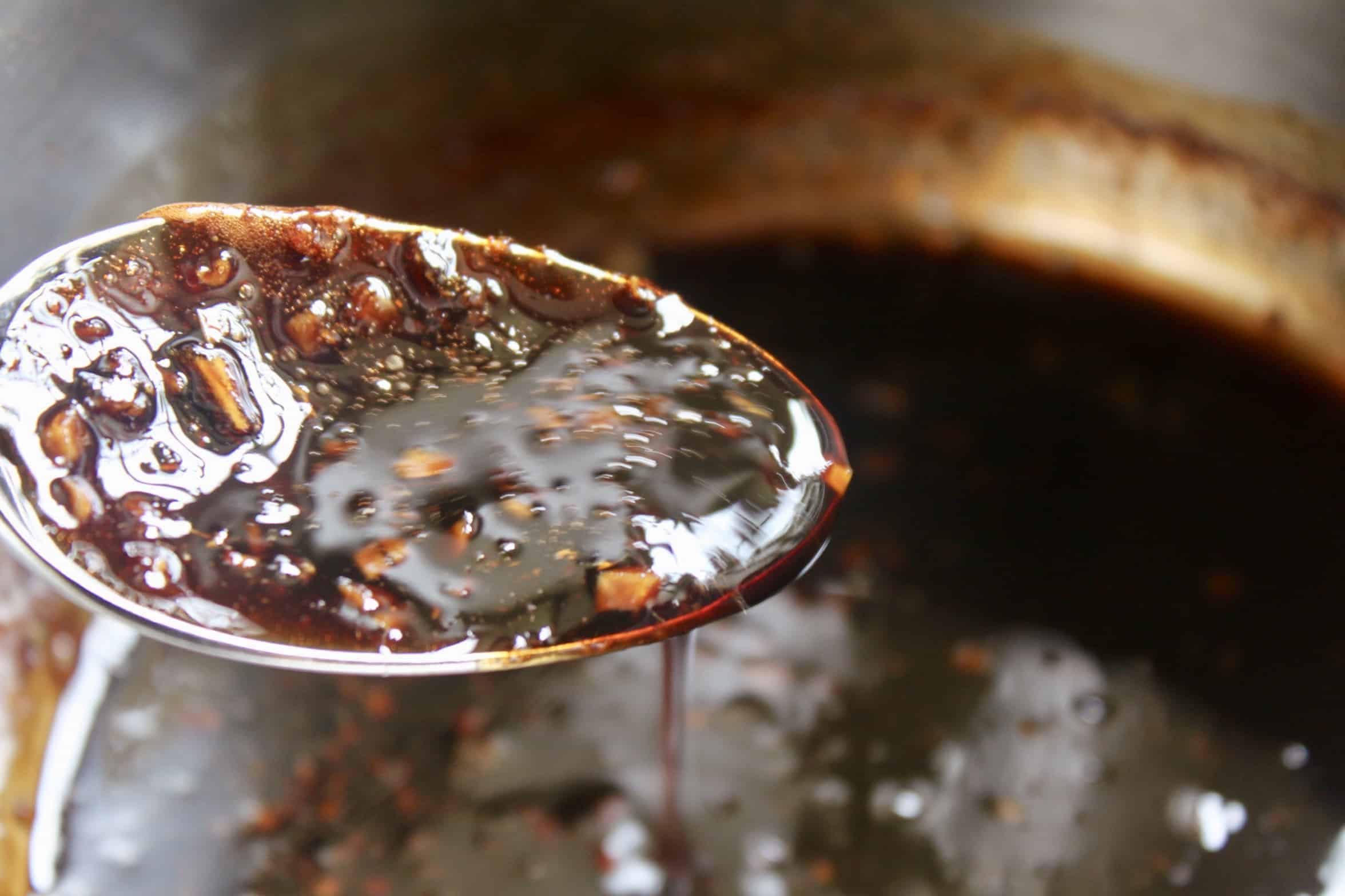 pouring sauce from a spoon